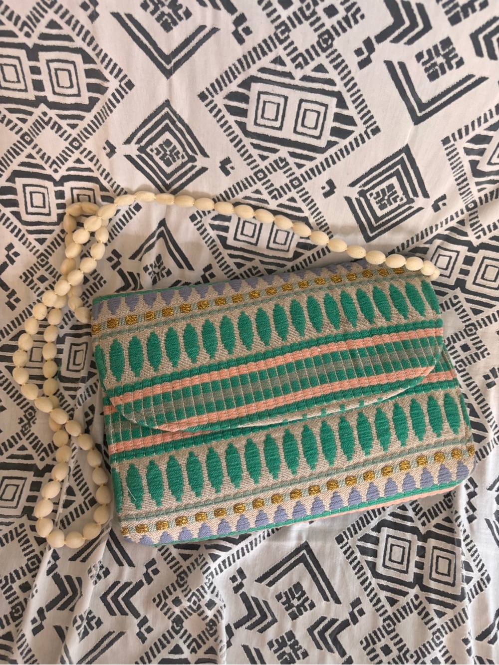 Green Patterned Woven Clutch w a shoulder Strap, button closure,fabric exterior